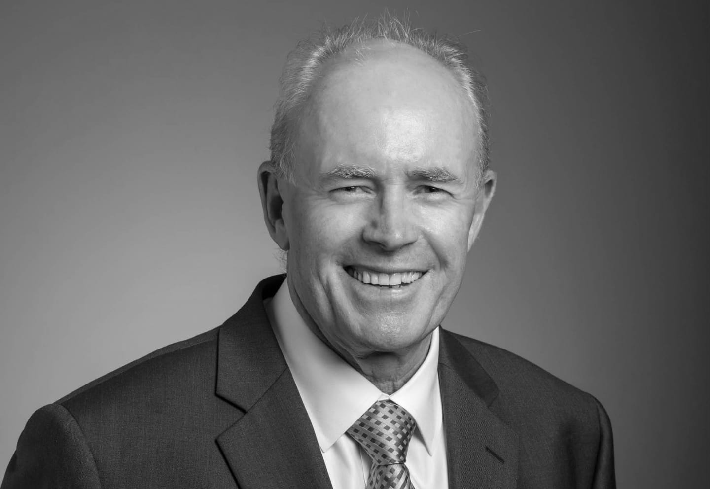 Black a white portrait image of Malcolm Mccolm